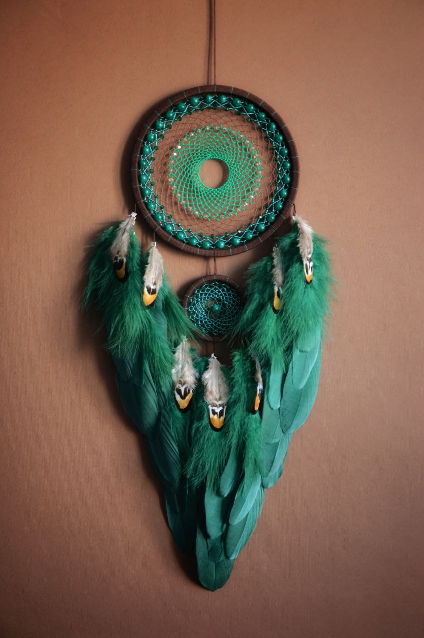 large brown green dream catcher with glass beads