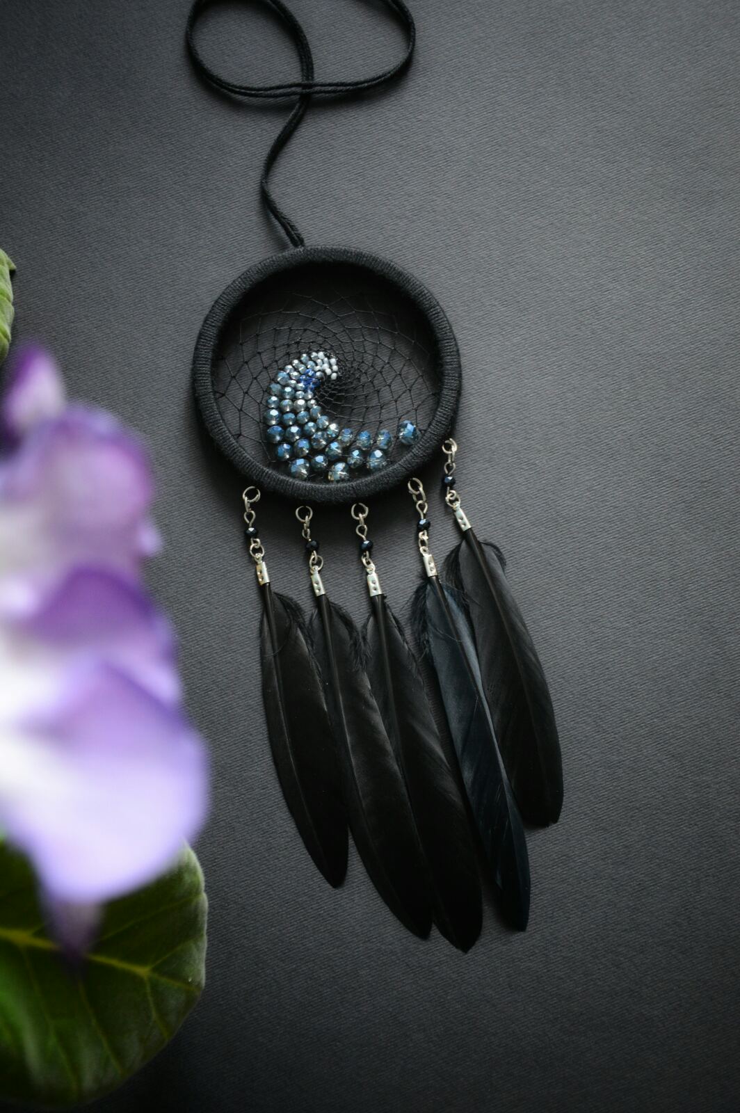Small black dream catcher with blue wave ornament