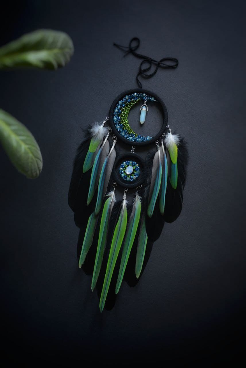 Colorful dream catcher with drum parrot feathers