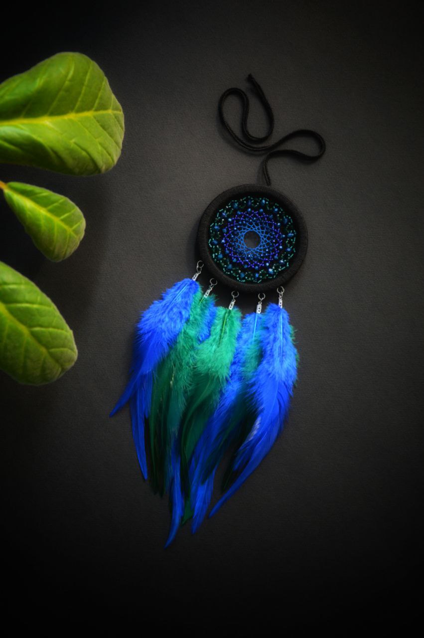 Small black dreamcatcher with green and blue feathers