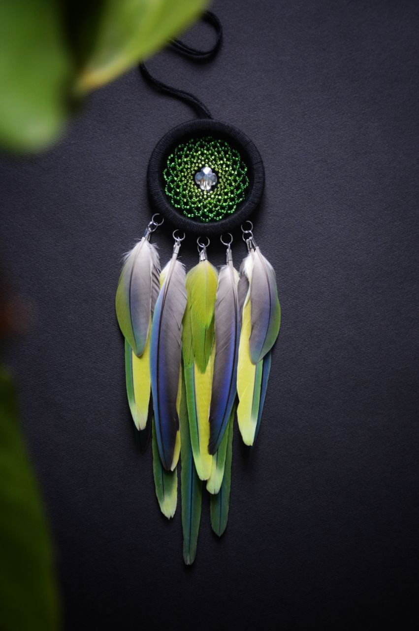 mini green dream catcher with parrot feathers